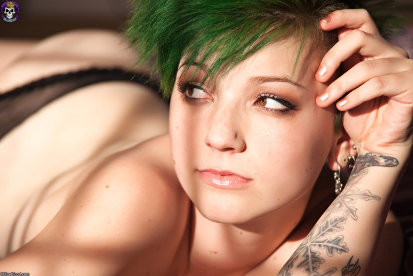 Girl with short haircut and tattoo
