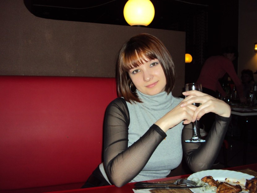 Woman against the background of the sun