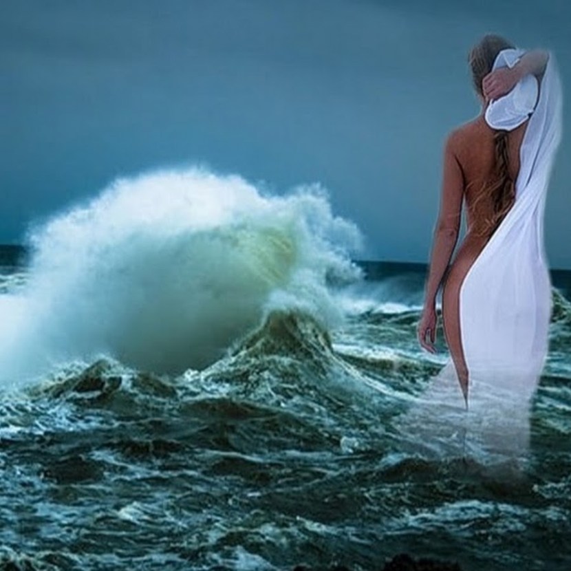 Girl in the waves of the sea